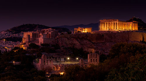 Illuminated buildings in city at night