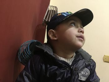 Portrait of boy looking away at home