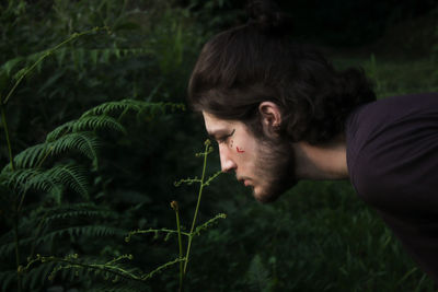 Side view of young man looking away