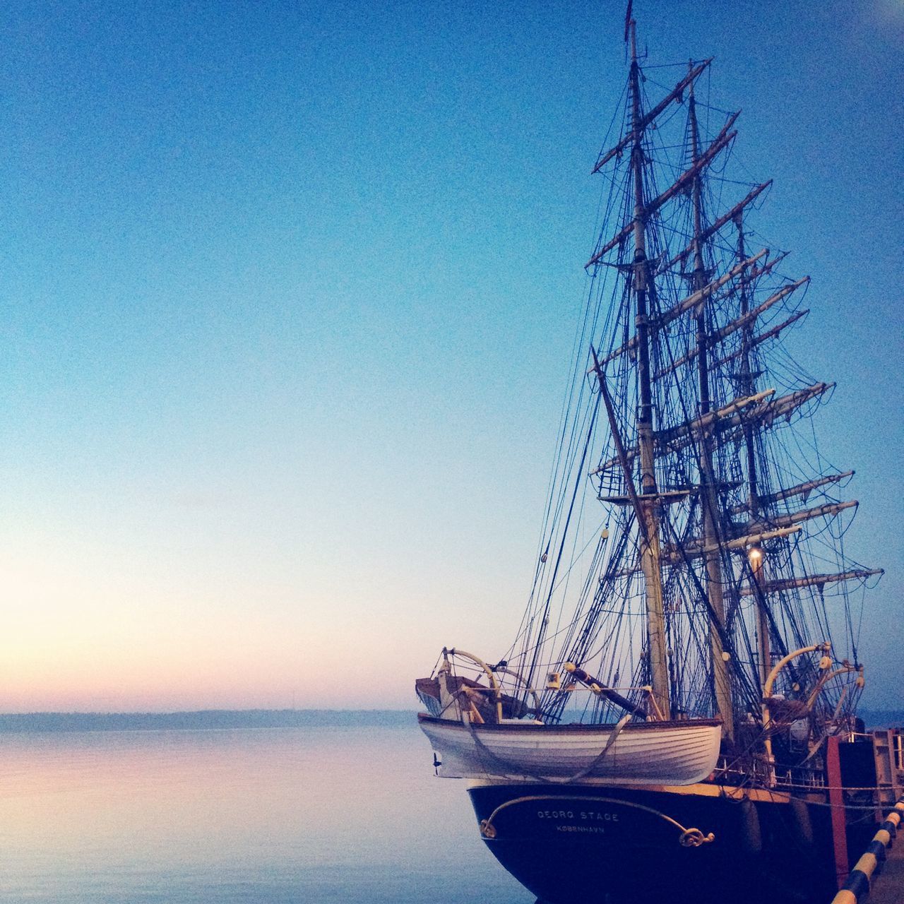 clear sky, nautical vessel, blue, sea, water, transportation, copy space, mode of transport, boat, waterfront, horizon over water, tranquility, nature, tranquil scene, moored, sailboat, outdoors, scenics, no people, beauty in nature