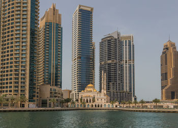 Modern buildings against sky in city