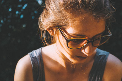 Close-up of young woman in eyeglasses