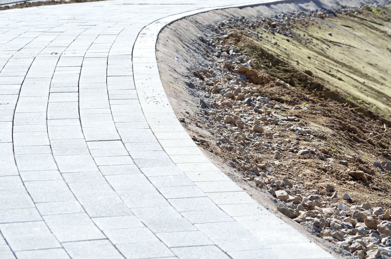 HIGH ANGLE VIEW OF COBBLESTONE STREET