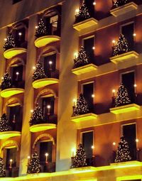 Low angle view of illuminated building at night