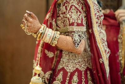 Midsection of woman wearing traditional clothing