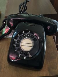 High angle view of rotary phone on table