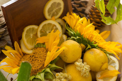 High angle view of yellow and flowers in container