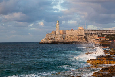 Scenic view of sea against cloudy sky