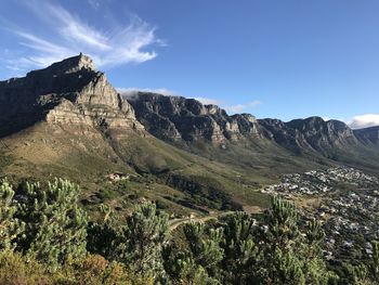 Scenic view of land and mountains against sky from lions head 