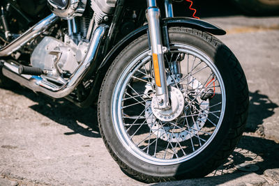 Close-up of motorcycle on road