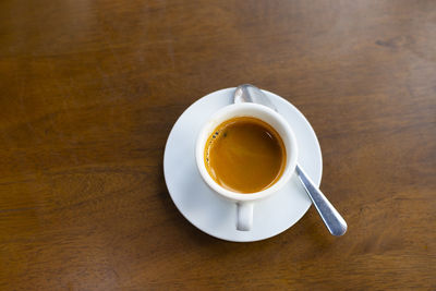 High angle view of coffee cup on table