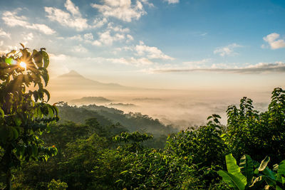 Scenic view of mountains against sky at sunset