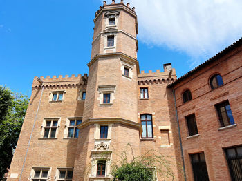 Low angle view of old building against sky