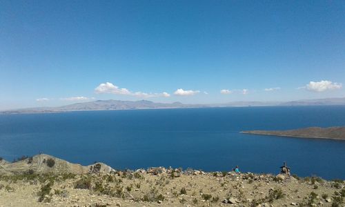 Scenic view of sea against blue sky