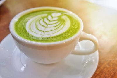 Close-up of cappuccino on table