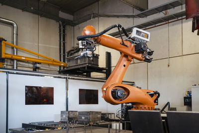 Industrial robots welding in factory