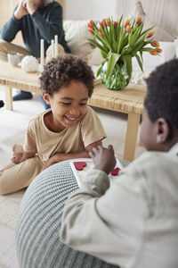 Brothers playing game at home