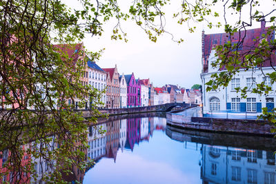 Reflection of buildings and trees in river