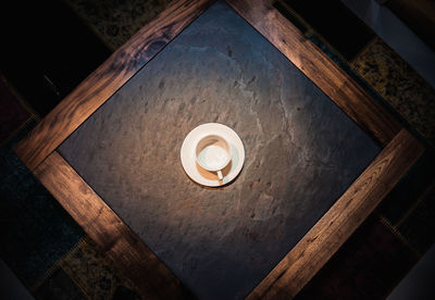 High angle view of illuminated lamp on table