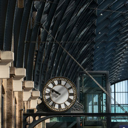 Low angle view of clock on wall