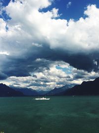 Scenic view of sea against cloudy sky