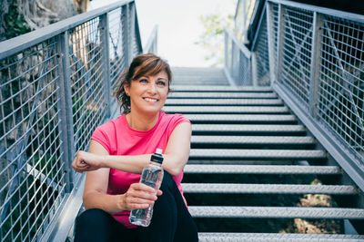 Portrait of smiling woman standing outdoors