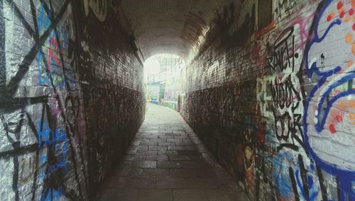 Graffiti on wall in tunnel