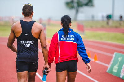 Rear view of men running