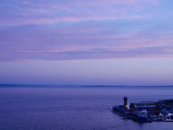 Scenic view of seascape against sky at sunset