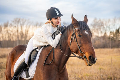 Side view of horse standing on field