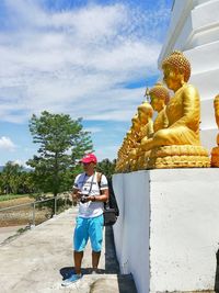 Statue of buddha against sky