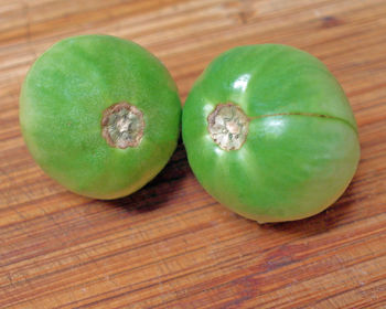 Close-up of green fruits on table