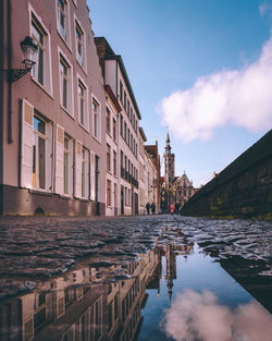 Canal amidst buildings in city