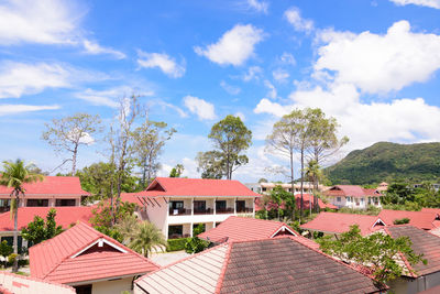 Houses in town against sky