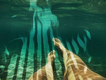 Double exposure of woman and swimming pool