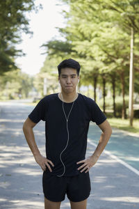 Portrait of young man standing outdoors