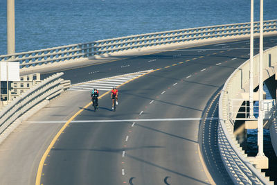 High angle view of jaber al ahmed bridge and 2 cyclists in the view