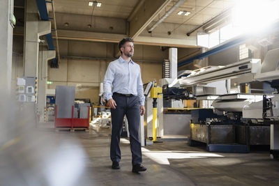 Portrait of man standing in corridor