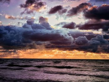 Scenic view of sea against dramatic sky