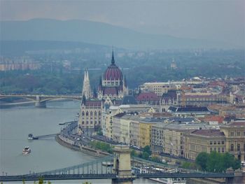 High angle view of buildings and river in city