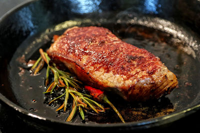 High angle view of meat in cooking pan