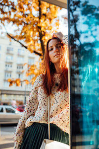 Beautiful young woman looking at camera