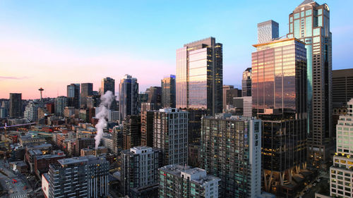 Modern buildings in city against sky