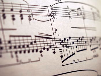 Close-up of piano keys on paper