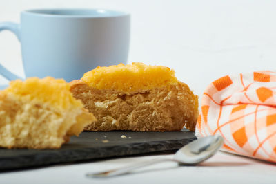 Close-up of cake with coffee on table