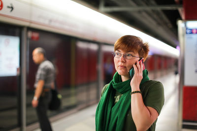 Portrait of woman using mobile phone