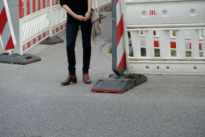 Low section of man standing on bus