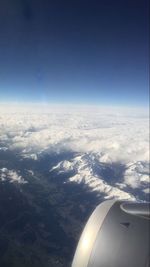 Aerial view of landscape against cloudy sky