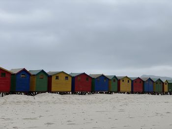 Beach huts against sky