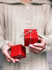 Midsection of woman holding gift box